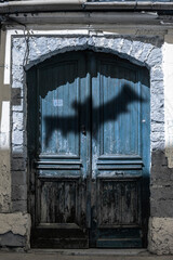 Old front door with bat shadow