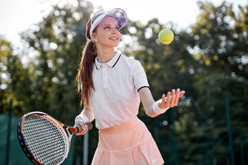 Backhand. Cheerful well-developed, professional movement of female tennis player. Beautiful...