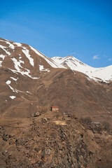 A lonely house on a hill in a mountain valley. The dwelling of the introvert