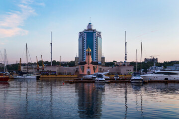 Port of Odessa, Ukraine at Black sea evening time. Luxury yachts and ships docked in harbor