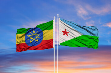 Djibouti and Ethiopia flag waving in the wind against white cloudy blue sky together. Diplomacy concept, international relations