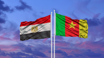 Egypt and Cameroon two flags on flagpoles and blue cloudy sky
