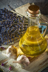 A bottle of organic olive oil on a rustic background