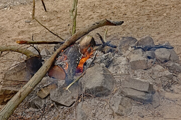 Small campfire on the beach of river Rhine 