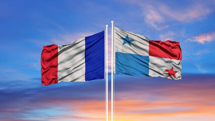 France and Panama two flags on flagpoles and blue cloudy sky