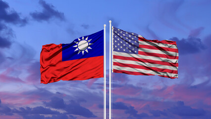 Taiwan and United States two flags on flagpoles and blue sky