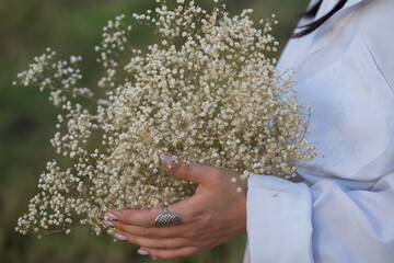 girl holding a bouquet of flowers