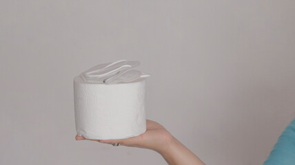 Toilet paper for the bathroom and white mask to prevent the spread of viruses and bacteria.