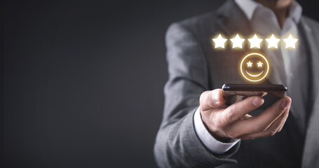 Man holding smiling face and five stars. Feedback. Customer satisfaction