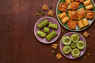 Traditional turkish, arabic sweets baklava assortment with pistachio and walnut. Top view