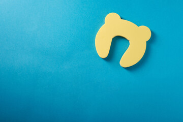 Child protection on the door on a blue background, top view