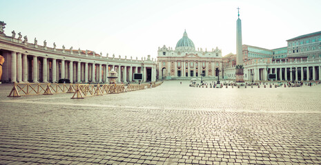 Panorama in Piazza San Pietro, or Saint Peters Square, in daylight with a view of the basilica in...