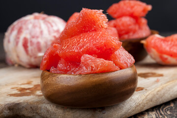 peeled red grapefruit divided into slices