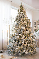 Christmas tree decorated in retro style with white and blue balls, vertical orientation © Oksana