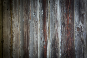 Wooden logs of an old house. Close-up. Weathered natural gray wood texture. Background. Horizontal photo.
