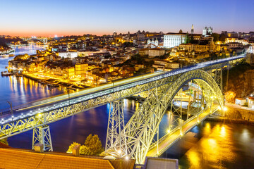 Porto Portugal with bridge Ponte Dom Luis I Douro river town travel at twilight