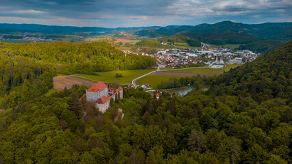 Panoramic aerial drone view of castle of Mirna on a summer day. Picturesque castle in dolenjska region of Slovenia