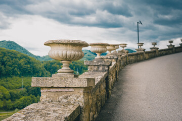 Row of ornaments for flowers or vintage flower pots on the Sevnica castle on a cloudy day.