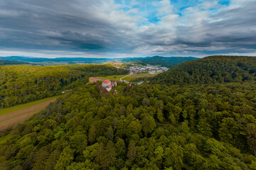 Fototapeta na wymiar Very wide Panoramic aerial drone view of castle of Mirna on a summer day. Picturesque castle in dolenjska region of Slovenia