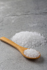 Fototapeta na wymiar Handful of coarse salt on the table.