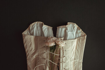Victorian style: vintage beige corset and three roses