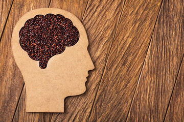 Black organic quinoa seeds in the brain shaped bowl - Chenopodium quinoa