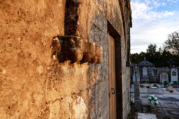 door of a medieval church surrounded by tombs