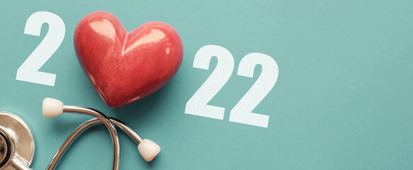 2022 with Red heart nad stethoscope, heart health,  health insurance concept, new year resolutions...