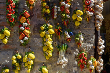 Sirmione, Italy - September 28, 2021: Ceramic souvenirs shaped like lemons and garlic.