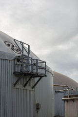 A biogas and composting plant under an overcast sky
