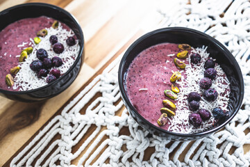 vegan acai blueberries coconut smoothie bowl, healthy plant-based food
