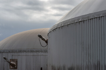 A biogas and composting plant under an overcast sky - obrazy, fototapety, plakaty