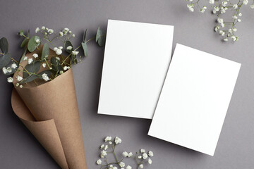 Wedding invitation card mockup with copy space, front and back sides, eucalyptus and gypsophila...