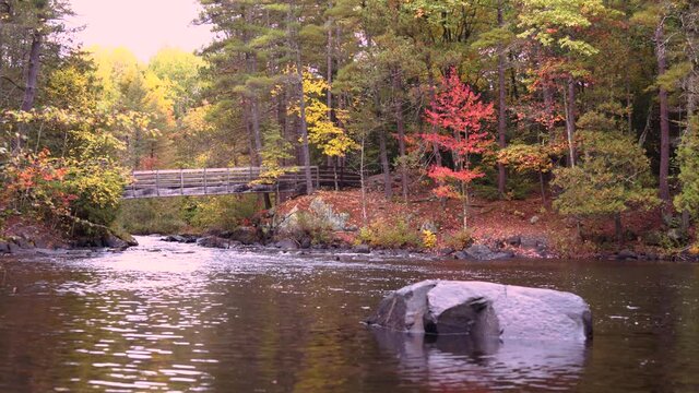 Wooden bridge over Daves Falls in Amberg Wisconsin in Autumn