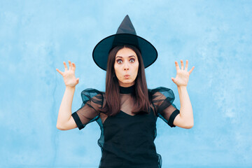 Funny Woman Wearing Witch Costume Trying to Look Scary