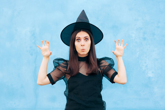 Funny Woman Wearing Witch Costume Trying to Look Scary