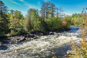 Penobscot River surrounded by early fall foliage in Baxter State Park Maine
