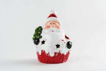 Santa Claus isolated on white background. Christmas ornament. Selective focus.