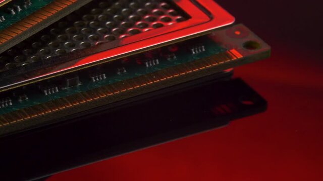 Memory RAM chip for computer isolated on red light mirror background. Upgrade or repair concept. PC hardware, electronic concept. Random access memory, computer PC detail or components