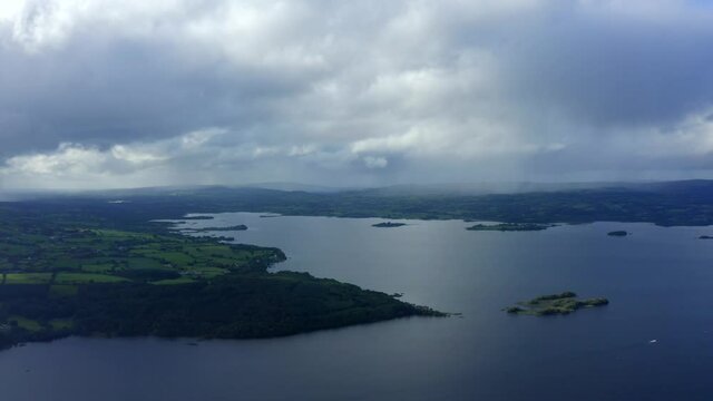 Lough Derg, County Tipperary, Ireland, September 2021. Drone gradually ascends while pulling east towards Nenagh across Carrowgar Bay while looking back at the lake.
