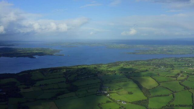Lough Derg, County Tipperary, Ireland, September 2021. Drone gradually pushes across Nenagh parallel with Carrowgar Bay while looking north towards the lake and the river Shannon.
