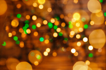 Blurred Christmas lights. Twinkle lights bokeh. Holidays. Defocused gold lights. Abstract holiday background. Beautiful shiny Christmas lights. Glowing magic bokeh. Defocused sparkles background.