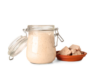 Jar with fresh sourdough and yeast on white background