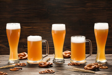 Glasses of cold beer and pretzels on table. Oktoberfest celebration
