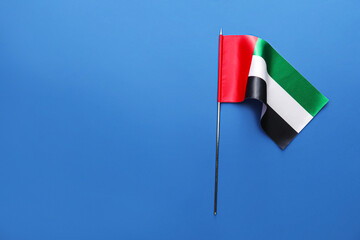 Flag of United Arab Emirates on blue background