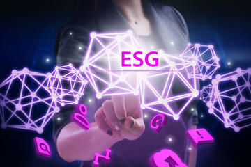 Business, Technology, Internet and network concept. Young businessman working on a virtual screen of the future and sees the inscription: ESG