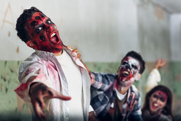 Scary zombies in ruined building