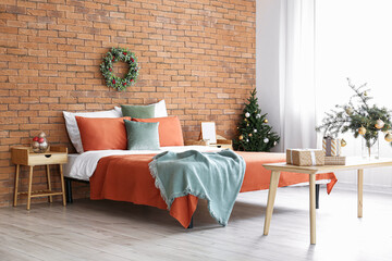 Interior of beautiful modern bedroom decorated for Christmas