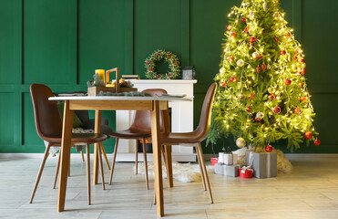 Interior of living room with table setting for Christmas dinner