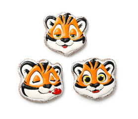 Cute cookies in shape of tiger for New Year 2022 on white background